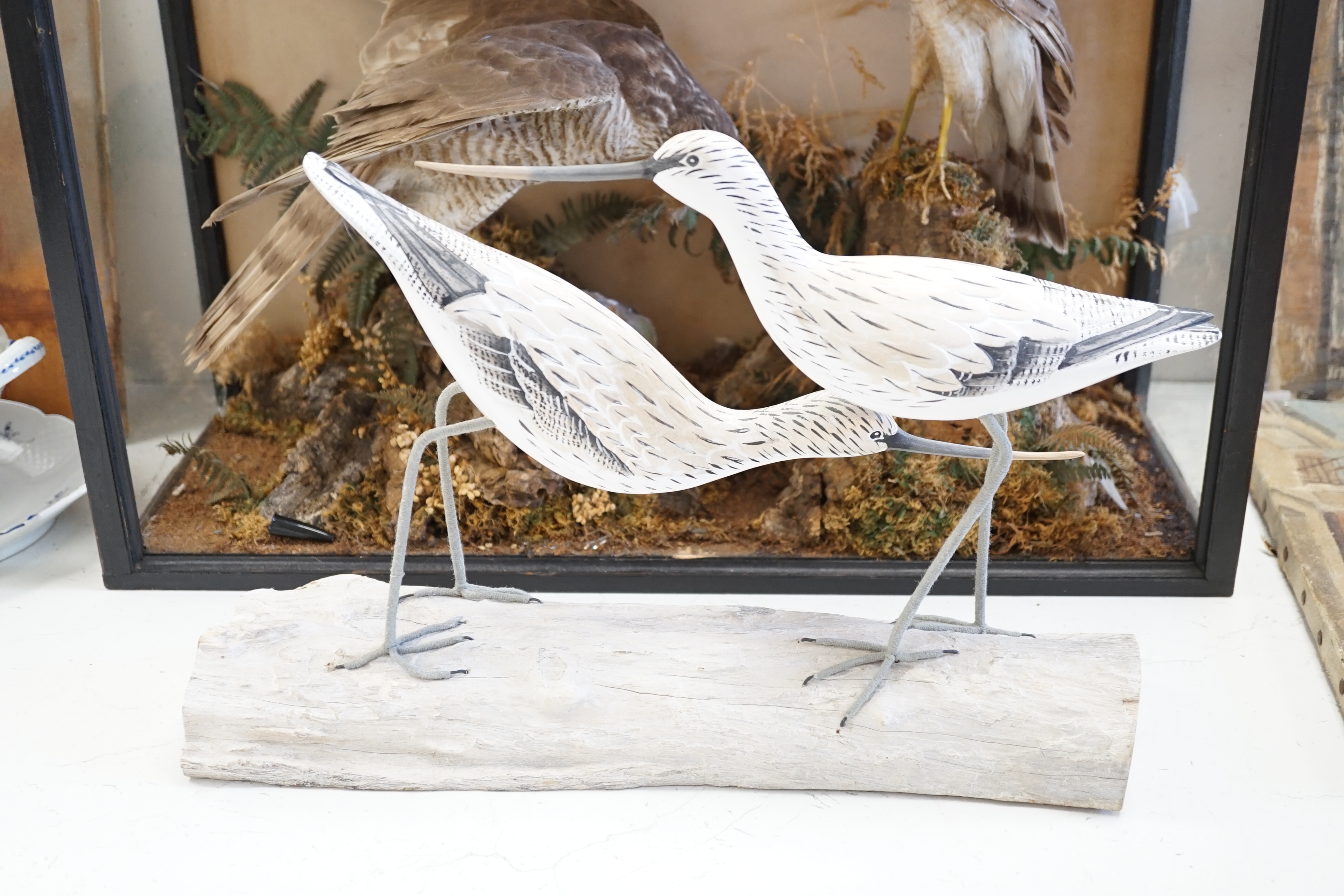 A collection of wooden painted ducks and waders
